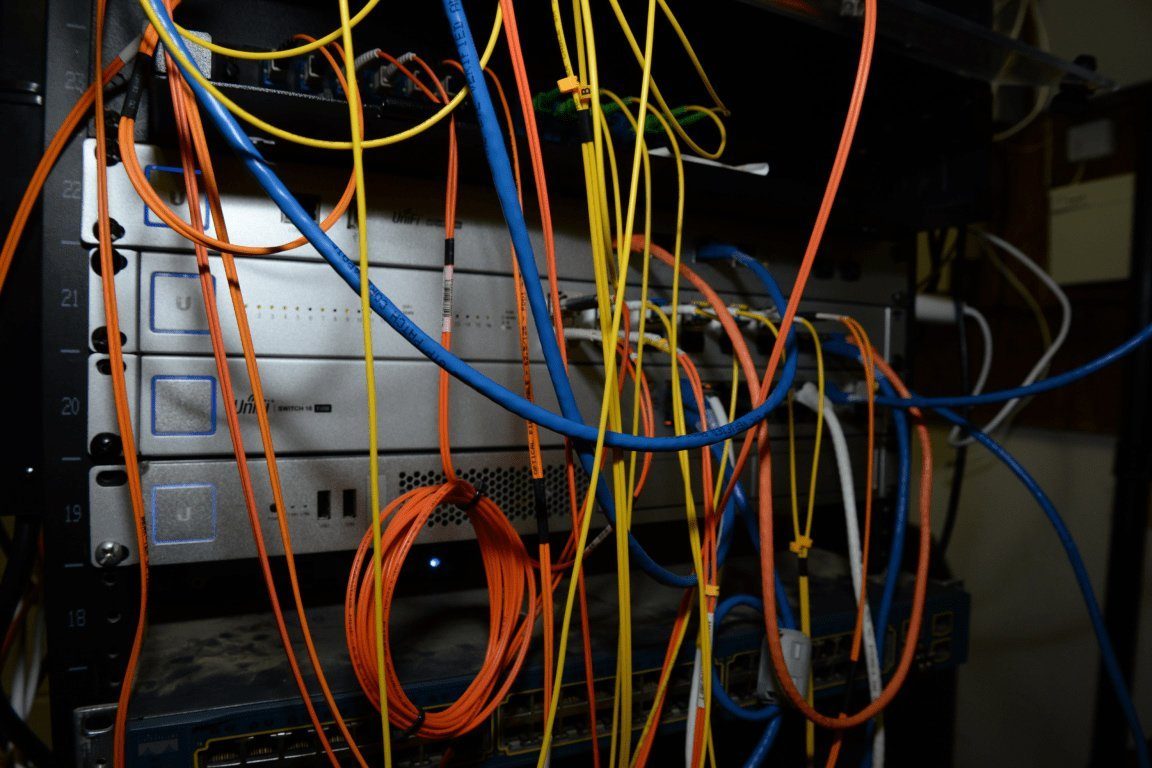 Dense network and power cabling at the rear of a server rack