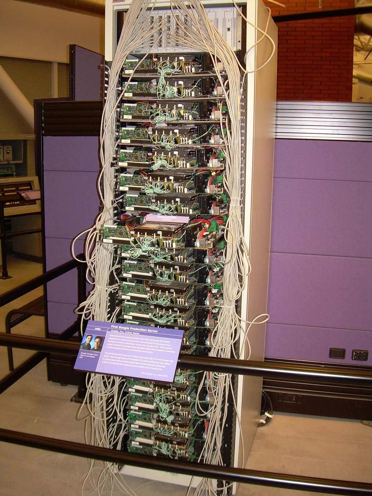 Historic production server hardware displayed in a museum rack